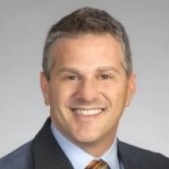 headshot for Adam Stoltz